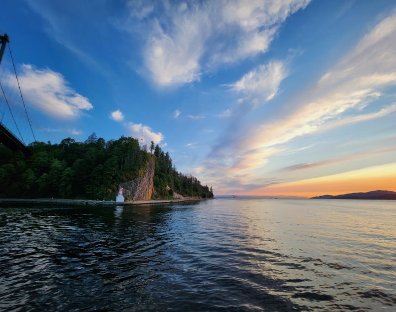 An epic west coast view of water, land, trees, sky.