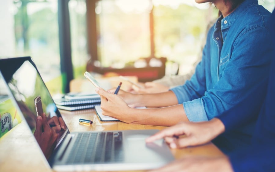 business woman with computer and papers