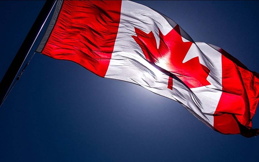 Canada flag with sun behind